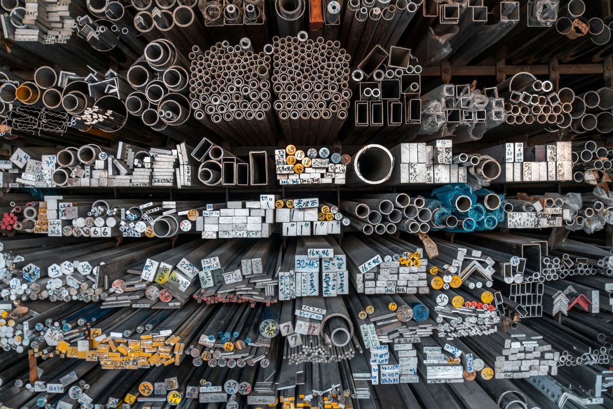 Racks of aluminium tubes and profiles in a stock store