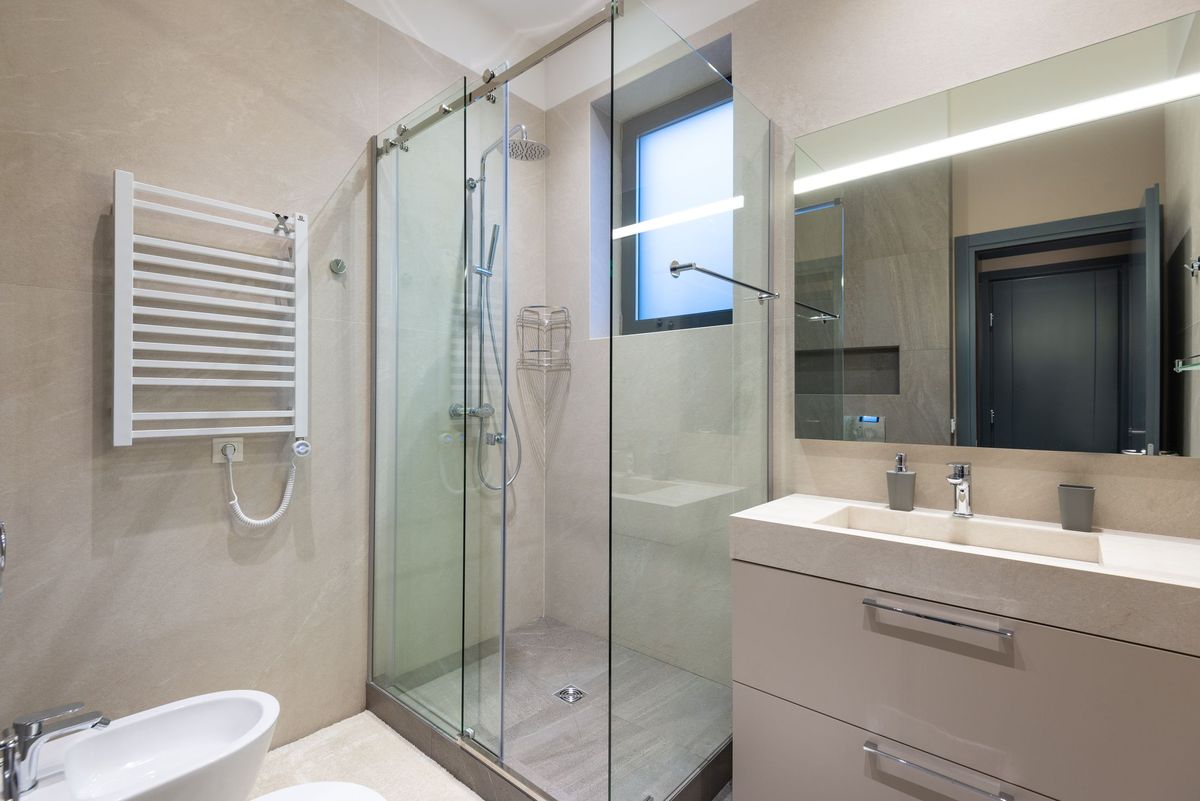 Frameless sliding glass shower screen in a modern bathroom